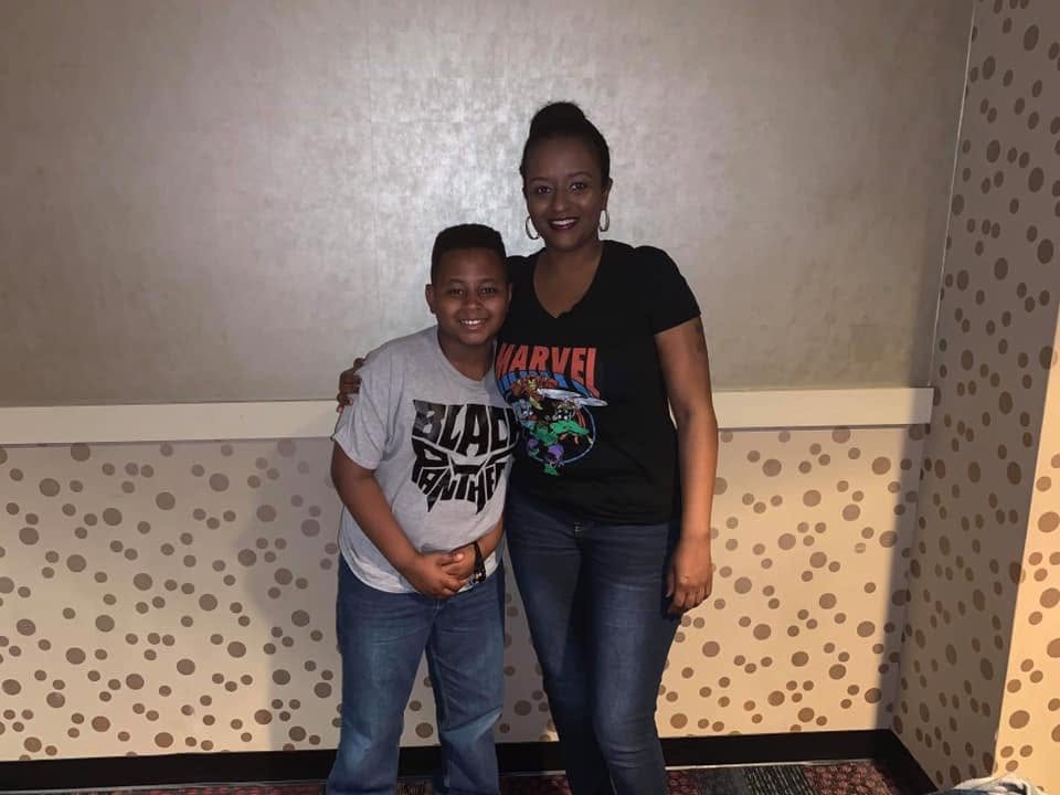 A parent and child enjoying the 2019 movie night